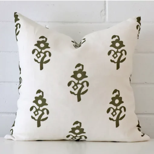 An alluring linen square cushion cover in olive green. It features an attractive patterned style.