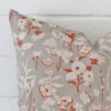 This image shows a grey cushion cover from a very close range. The square size and linen material are more clearly shown.