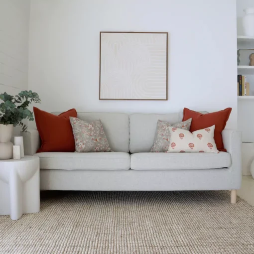 The elegance of the light grey sofa is enhanced by the Avery sofa cushion set, which features five cushions.