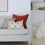 Cushions from the Avery sofa cushions set of 5 add warmth to a white living room.