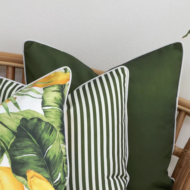 A zoom in view of this set of 3 olive outdoor cushion covers.