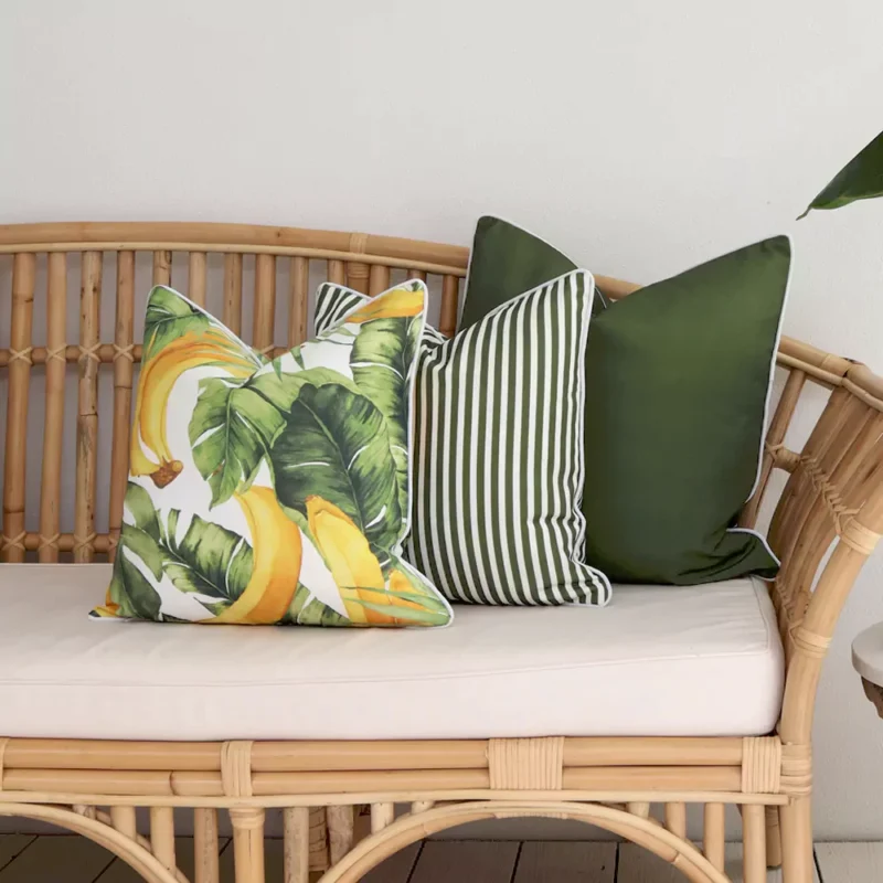 banana-olive-outdoor-couch-cushions-set-3-covers-colo1160c A set of 3 olive outdoor couch cushions sits on a rattan seat.