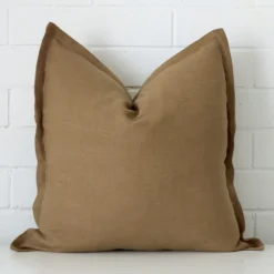 An alluring linen large cushion cover in fawn.