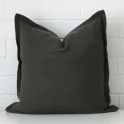 A graceful large moss green cushion that is made from a linen fabric.