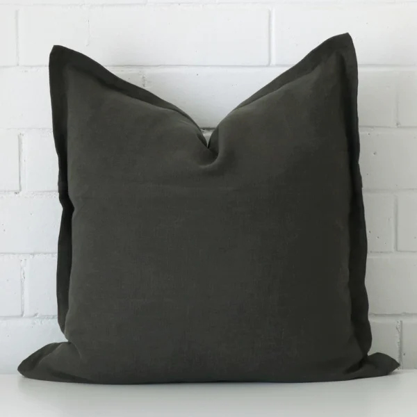 A graceful large moss green cushion that is made from a linen fabric.