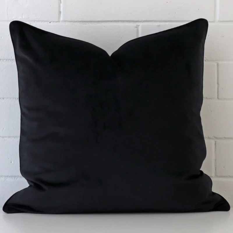 black-velvet-cushion-cover-55cm-x-55cm-sc764-55b A close up image of this large cushion. The image shows details of its velvet fabric and black colour.