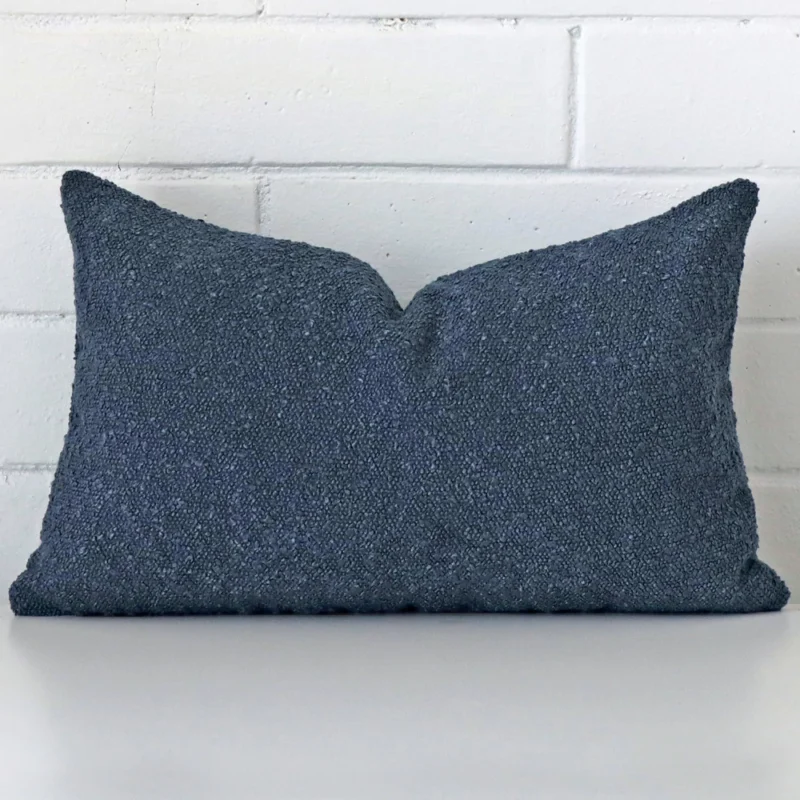 blue-boucle-cushion-cover-rectangle-sc1032-30 Dark blue boucle blue cushion with texture on white wall