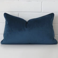 An alluring velvet rectangle cushion cover in blue.