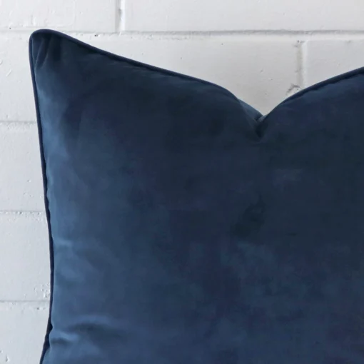 Macro image of a velvet large cushion cover. The shot shows the blue hue more thoroughly.