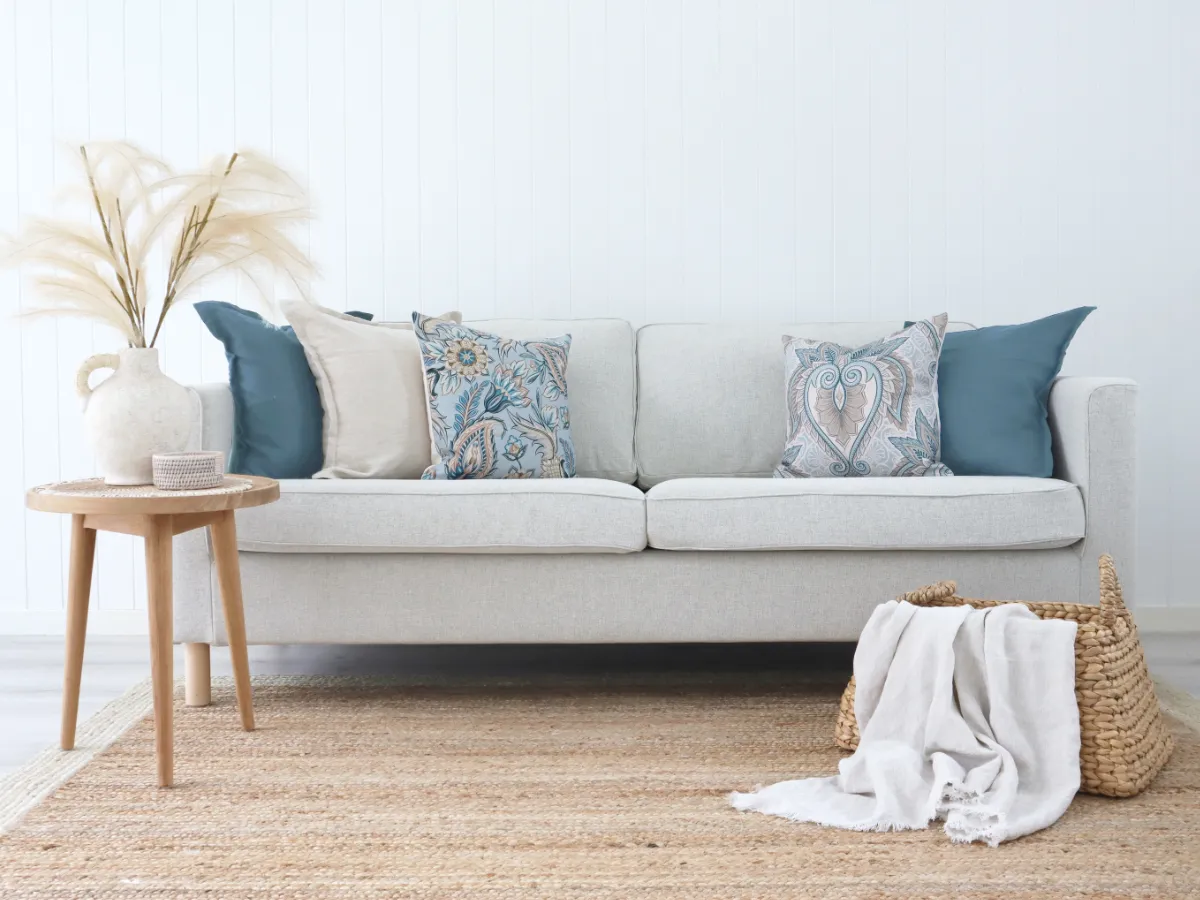 A boho chic styled sofa in a living with simple colour usage.