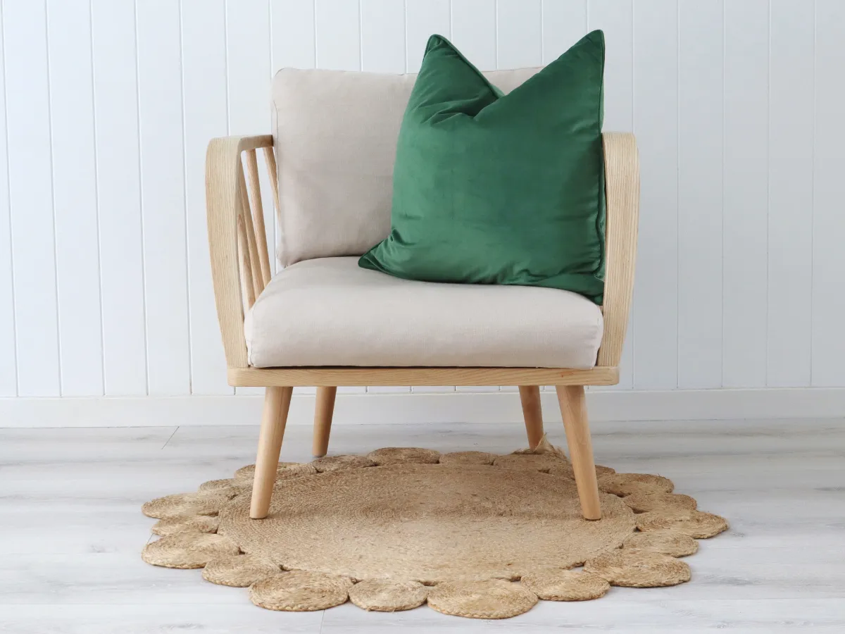A bold green colour design shines on a light sofa providing lots of contrast.