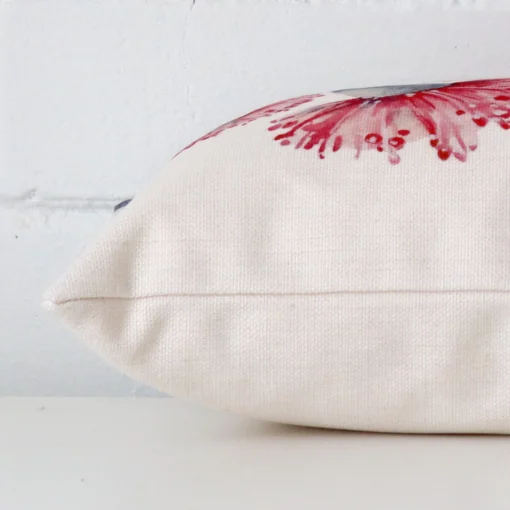 Lateral angle image of a linen rectangle cushion. The design is highlighted along its seams.