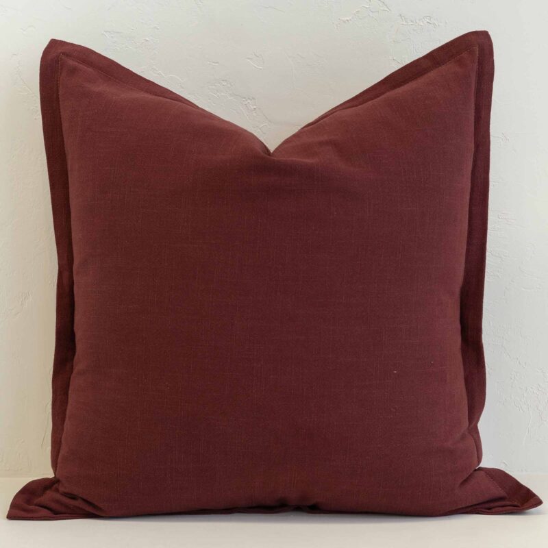 Burgundy linen cushion with deep red tone and subtle textured weave.