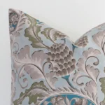 A macro image of the top left corner of this linen cushion, revealing the finer details of the square-shaped corner and its colours.
