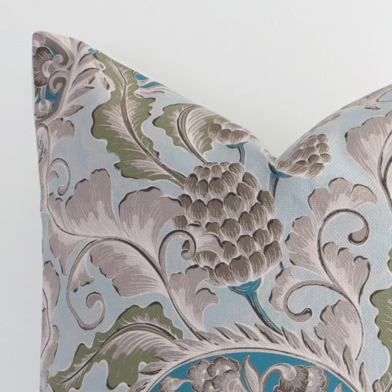 A macro image of the top left corner of this linen cushion, revealing the finer details of the square-shaped corner and its colours.