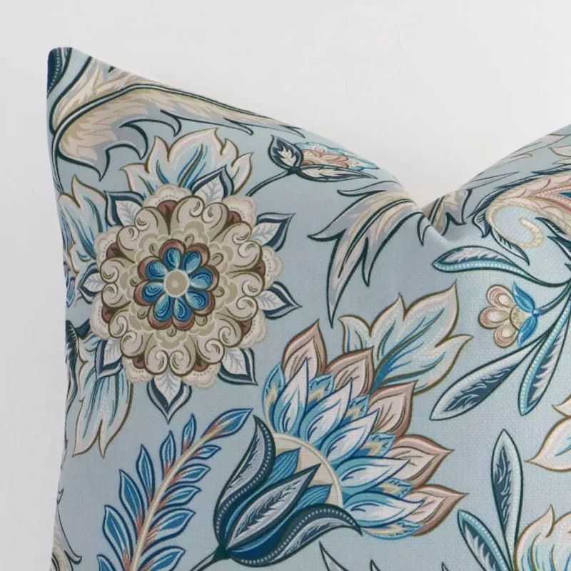 Close up image of linen square cushion. The image allows you to see the colorful hue and patterned style more thoroughly.
