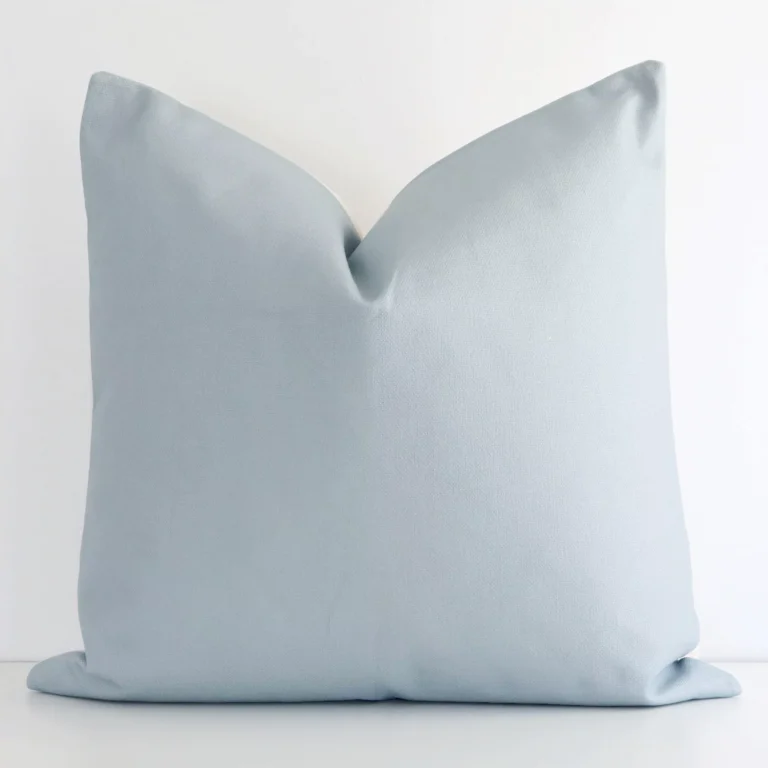 A lovely solid-coloured outdoor cushion in a sleek large size with a soft teal tone of colour.