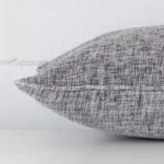 A rectangle linen cushion positioned flat to show its seams. The grey colour is visible as is the seam between the panels.