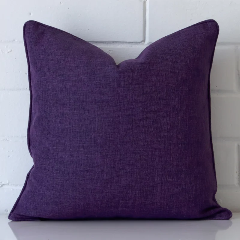 camden-purple-cushion-cover-45cm-x-45cm-sc455-45 A hero shot of a square cushion cover. It is made from a deluxe linen fabric and features a purple colour.