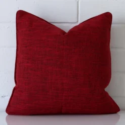 A stunning square linen cushion in a maroon colour.