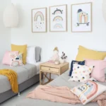 A child’s room is decorated with our NZ range of kids cushions in pink, blue and yellow.