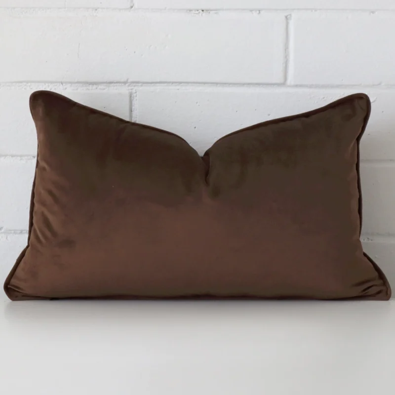 chocolate-brown-rectangular-velvet-cushion-cover-30cm-x-50cm-sc776-30 Here a chocolate brown velvet cushion is shown styled against a white wall. It has a rectangle design.