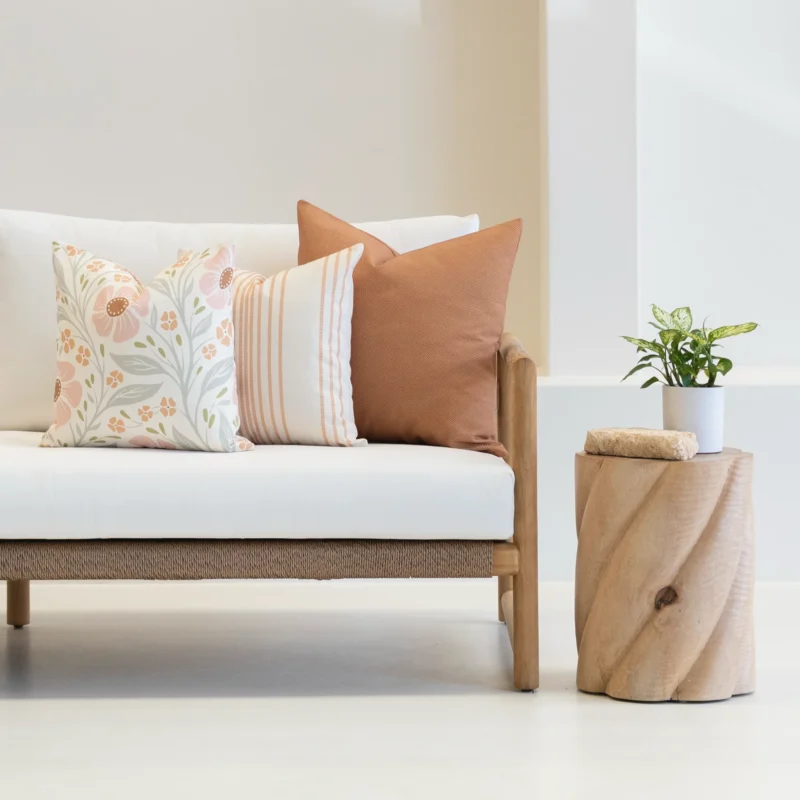 claybourne-outdoor-couch-cushions-set---3-covers---colo1217- Outdoor cushions from the set of 3 avena are arranged neatly on a white couch.
