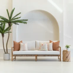 The claybourne set of 3 outdoor couch cushions are displayed on a white sofa.