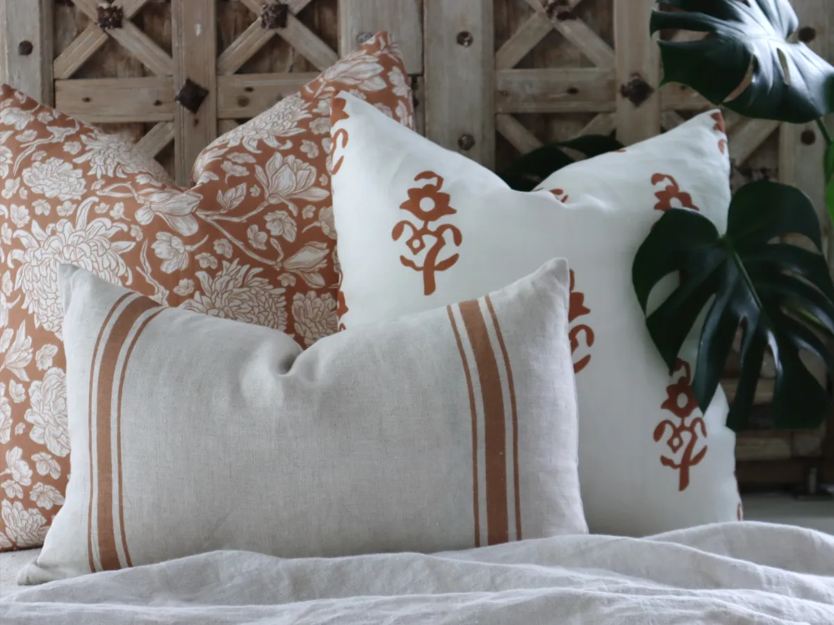 A collection of cushions with mid century modern inspired colours and patterns.