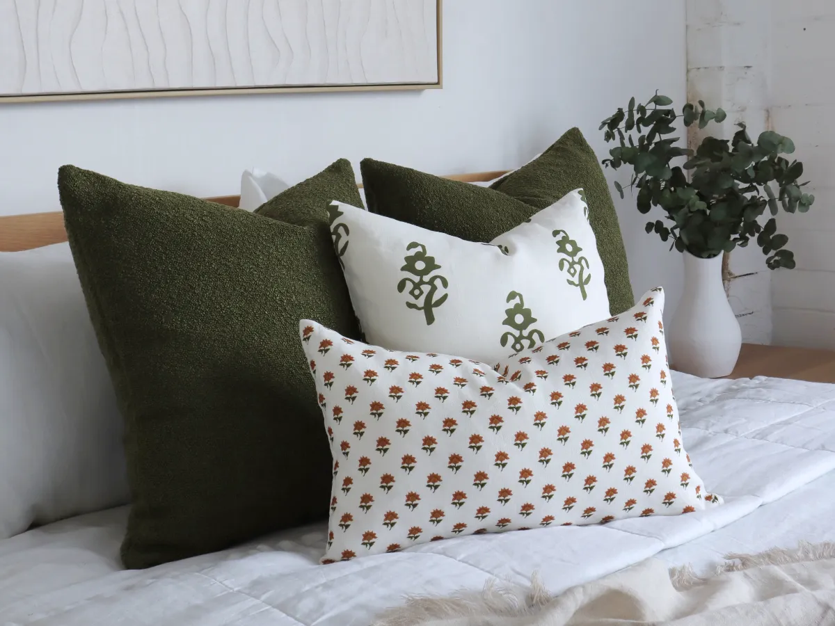 A collection of cushions that have boho chic features such as texture and organic pattern.