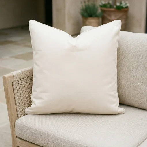 cream-waterproof-outdoor-cushion-cover----large---sc1079-55c Cream waterproof cushion on woven outdoor chair with tiled patio background.
