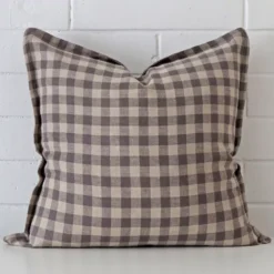 A superior designer cushion cover yielding a gingham style and in a classy large size.