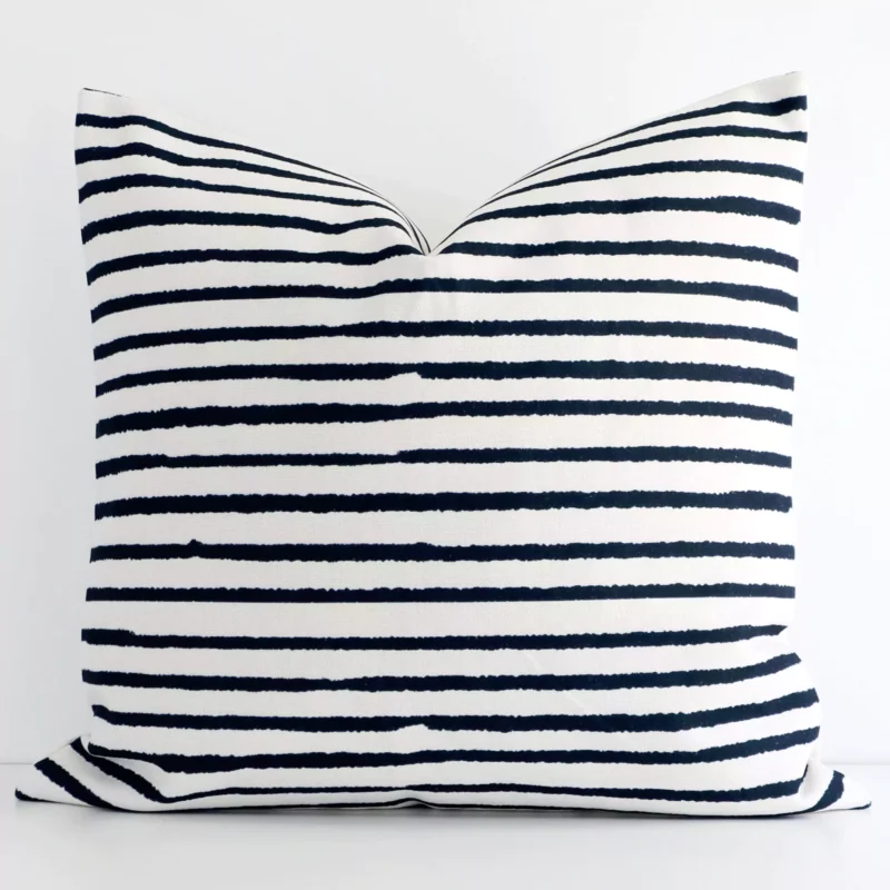 dia-stripe-cushion-cover---large---sc248-55 Bold large cushion positioned in front of white wall. Its striped style pops on the linen fabric.