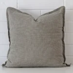 A bold gingham designer cushion in a sleek large size.