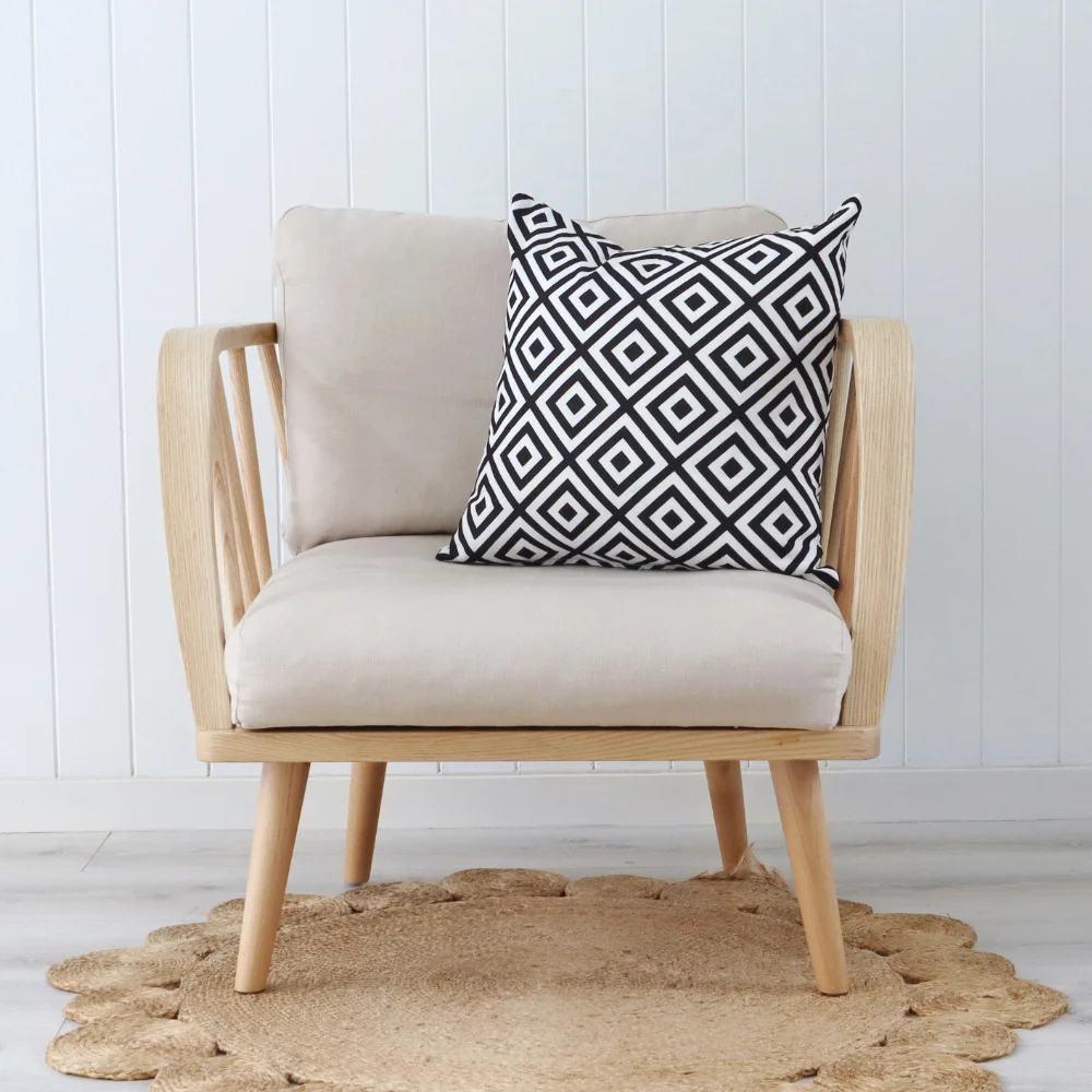 An elegant chair featuring a geometric cushion.