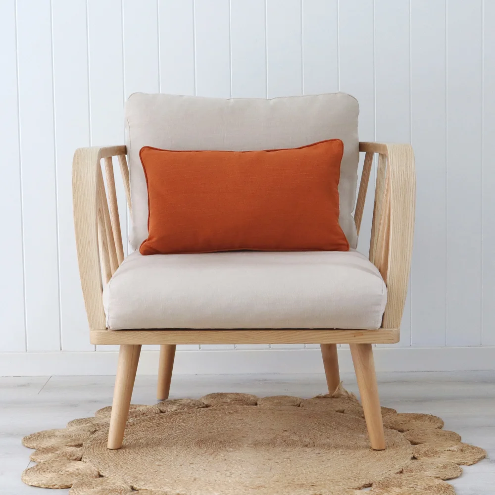 An elegant seat showcasing a rust cushion.