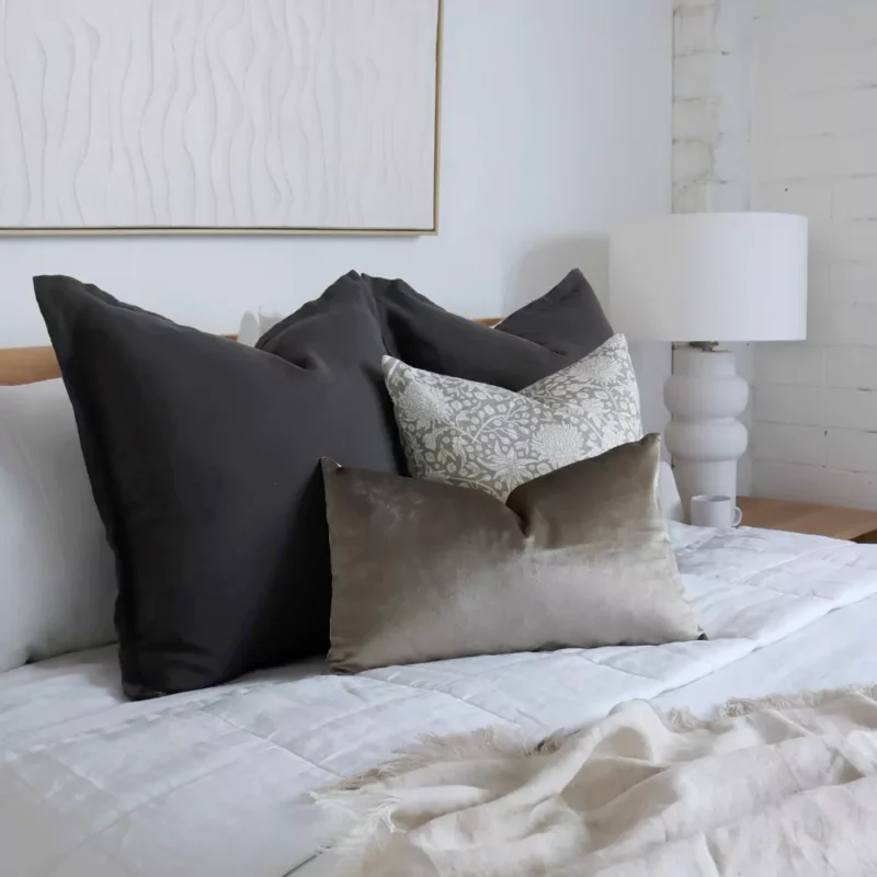 eliza-bed-cushions-set-4-covers-colc1121aa2 A side-view shot of the Eliza bed cushions set of 4 on a wooden bed.
