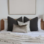 The collection of 4 bed cushions adds an elegant touch to the room's decor.