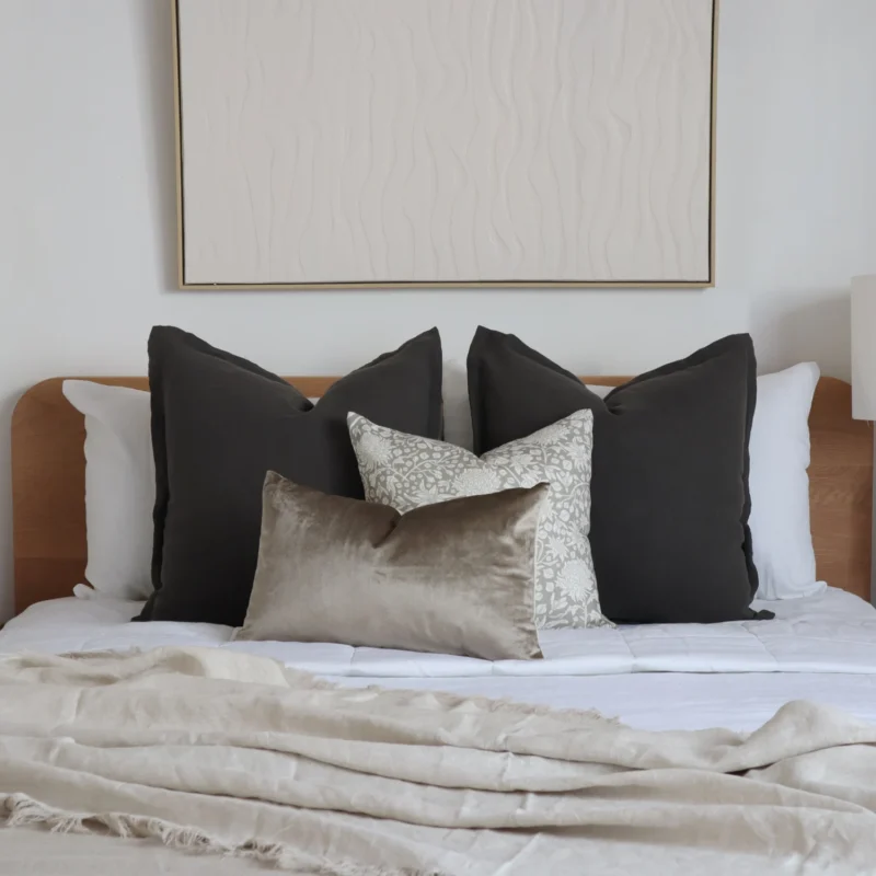 The collection of 4 bed cushions adds an elegant touch to the room's decor.