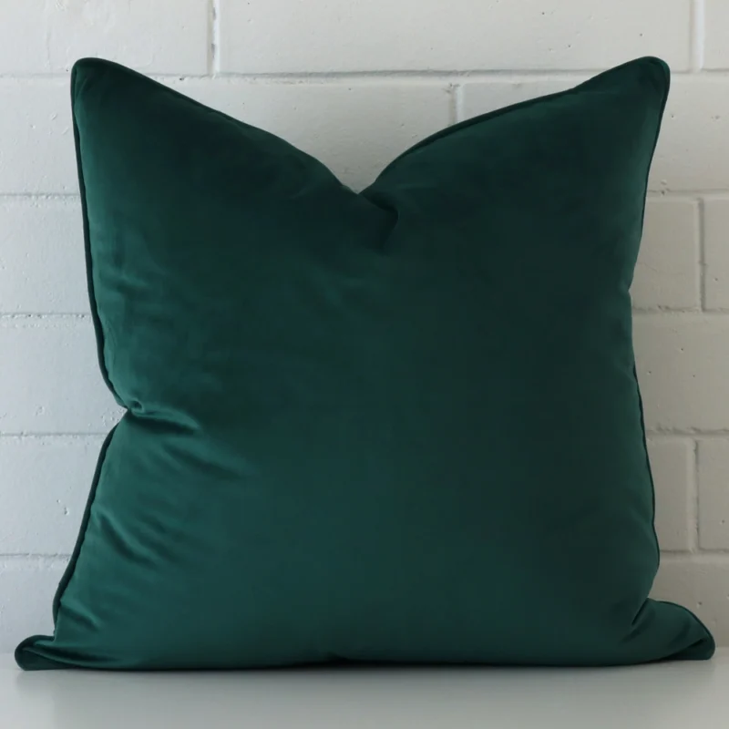 emerald-green-velvet-cushion-cover-55cm-x-55cm-sc499-55b A hero shot of a large cushion cover. It is made from a deluxe velvet fabric and features an emerald green colour.