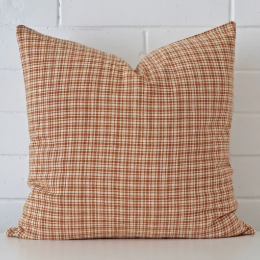 An alluring designer large cushion. It features an attractive gingham style.