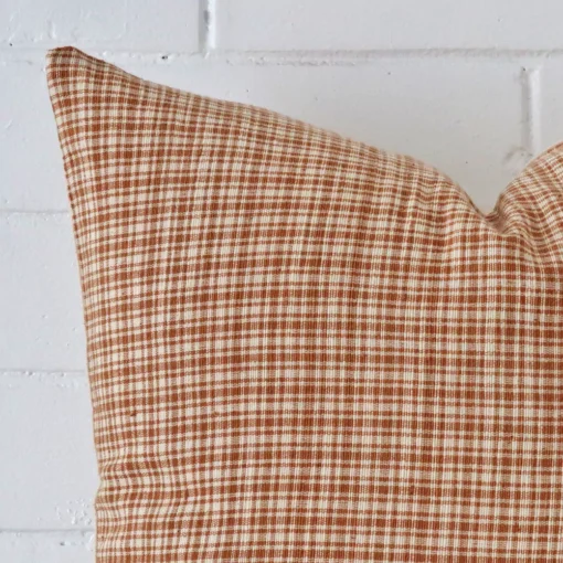A close up shot showing the top left side of this large deisgner cushion cover. The gingham design is magnified.