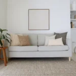 The elegant Essa sofa cushions, a set of 5 designer cushions gives the stylish look of a grey sofa in a living room.