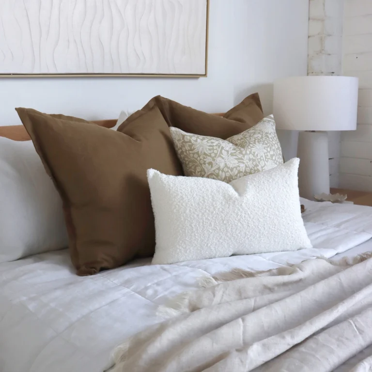 4 bed cushions from the Eve set complement the white bedroom perfectly.