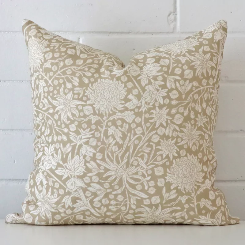 eve-linen-floral-cushion-cover-sc1013-45 A square floral cushion in a delightful tone rests against a white wall. The linen material appears to be of exceptional quality.