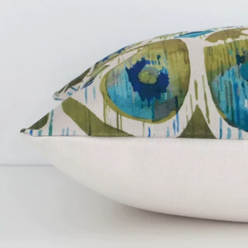 Lateral view of front and back panels of this patterned linen cushion cover in a square size and with colourful colouring.