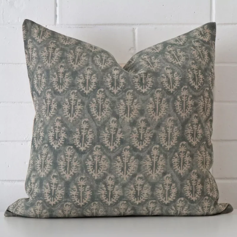florence-designer-cushion-cover-art127-55c A large cushion rests against a white wall. The designer material appears to be of exceptional quality.