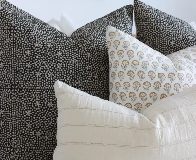 Four cushion covers shown at close range to highlight their texture.