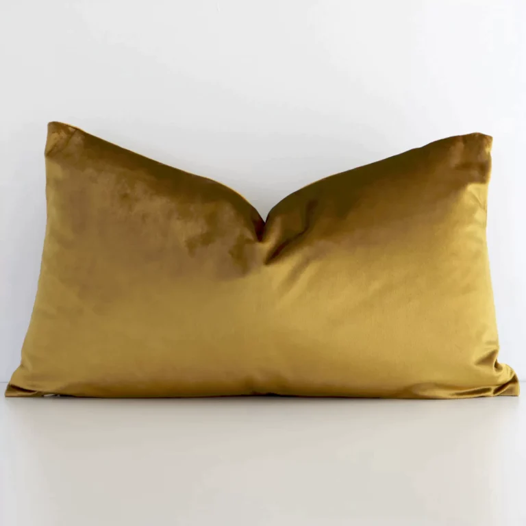 Front view of solid-coloured rectangular cushion. Crafted from a special velvet material in a gold mustard colour.