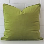 A bold velvet cushion in a sleek large size with a green tone of colour.